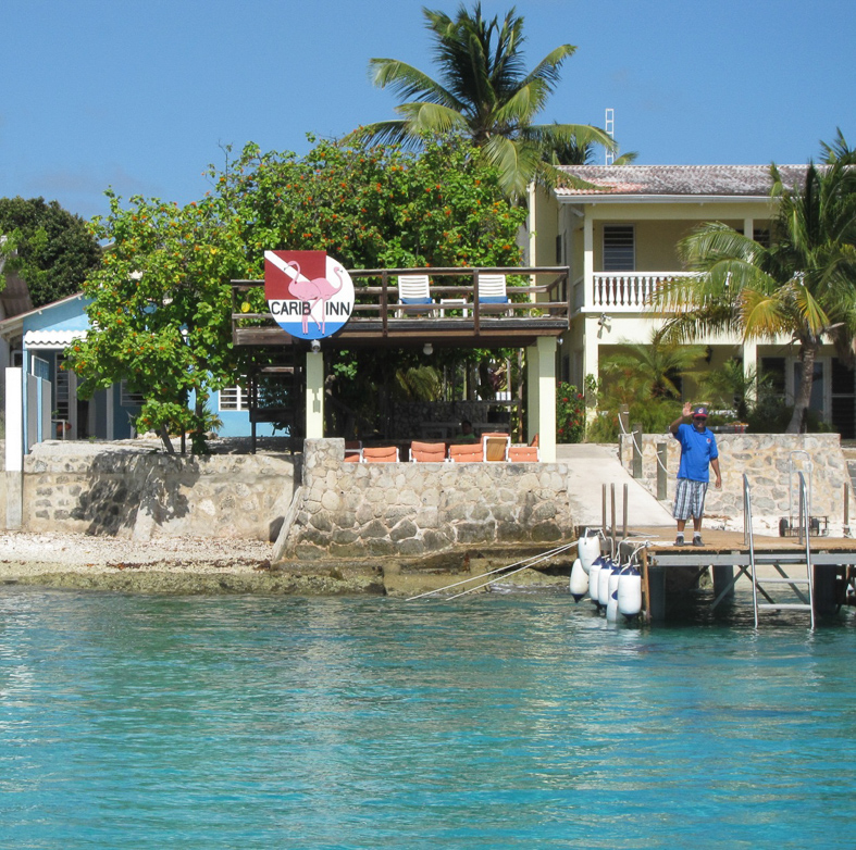 And back to the Carib Inn where Edward is waiting to help us tie up. We were in the small blue cottage and ate our breakfasts oceanside.